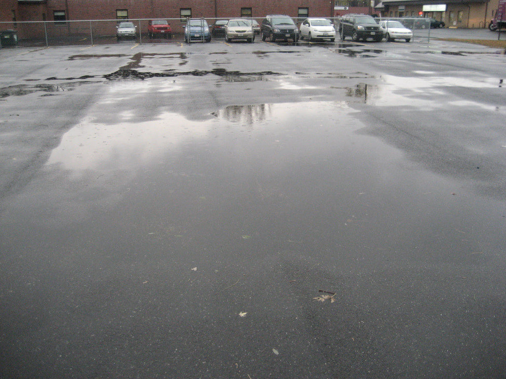Depressions in Parking Lot Olympia, WA Seattle WA Paving